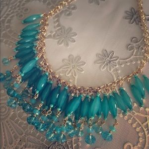 Teal with gold necklace
